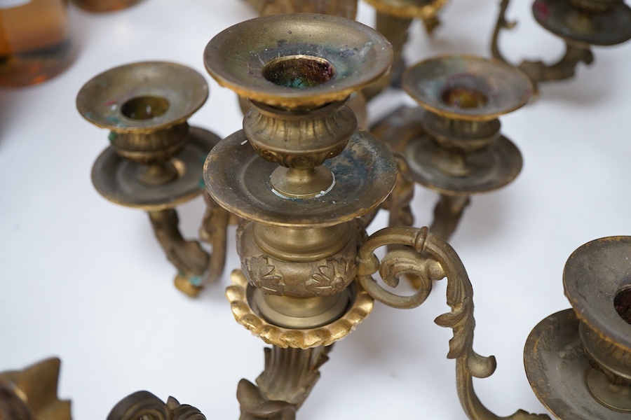 A pair of cast brass three branch wall sconces, 27cm deep